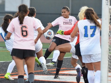 Carolina Apodaca Morales (20) attempts to knock in a corner kick in front of the goal during the first half of VC's 2-0 victory over Oxnard Tuesday at the Sportsplex.