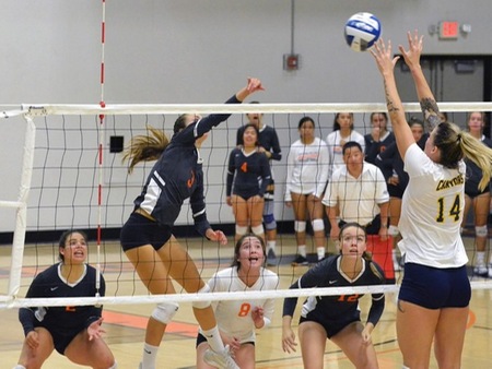 VC sophomore Vanessa Ihrke (3) goes for the kill while (from left) Raphaella Rosales (2), Leslie Perez (8) and Kassidy Wilson (12) prepare to defend behind the hit Friday night at the Athletic Event Center. VC dropped a difficult 3-1 decision to visiting Canyons.