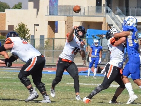 Quarterback Brock Domann (15) passed for 154 yards and a touchdown, and ran for another score as the No. 2-ranked Pirates nearly pulled off the upset at No. 1 Fullerton Saturday, falling 33-28 on a late Hornet touchdown.