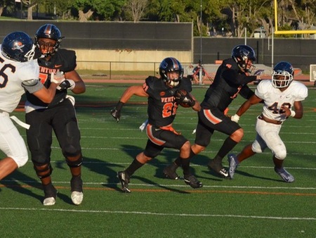 VC running back Chuck Wick finds an opening for a touchdown run with help from DJ Peterson (left, 71) and Daniel Moraga (7). Ventura defeated visiting Orange Coast 45-7 in the season opener.